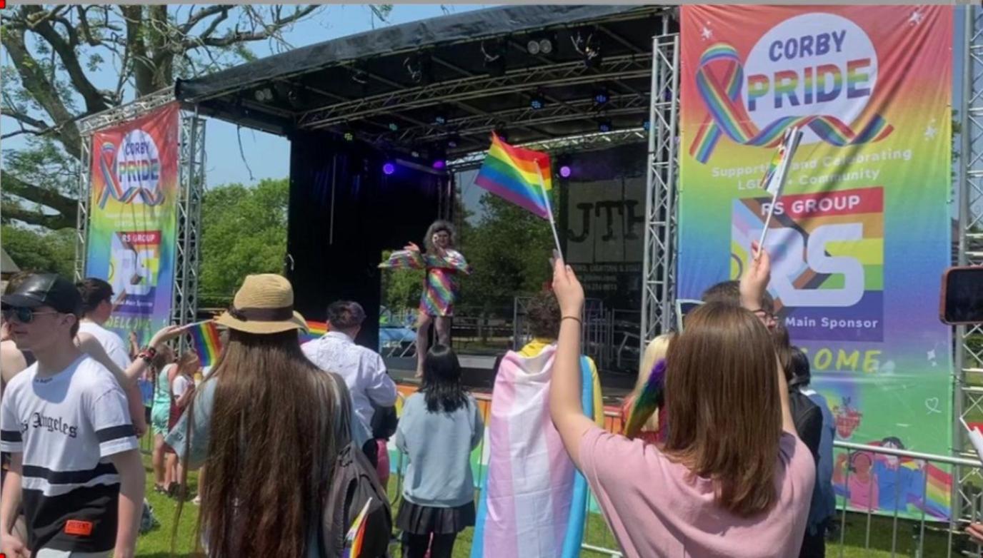 Guests watching an act perform on stage