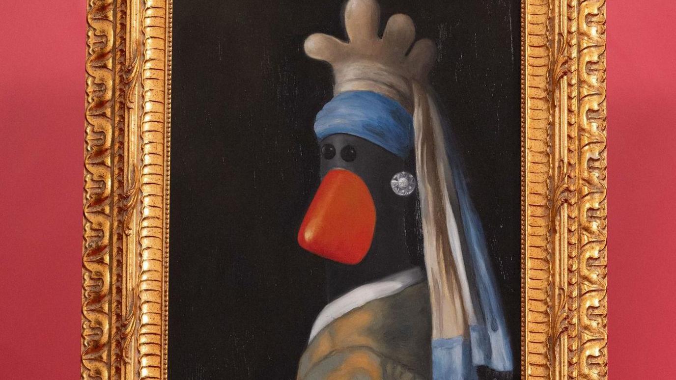 A gold framed painting of Feathers McGraws with a pearl earring, a parody of the famous oil painting. 