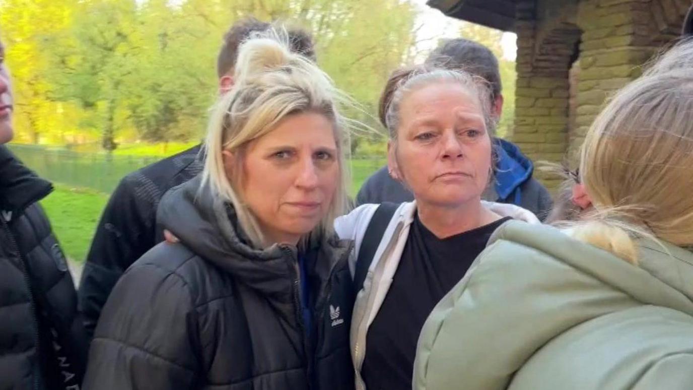 Caroline Flynn and group of people gather at a vigil in Hull's Pickering Park