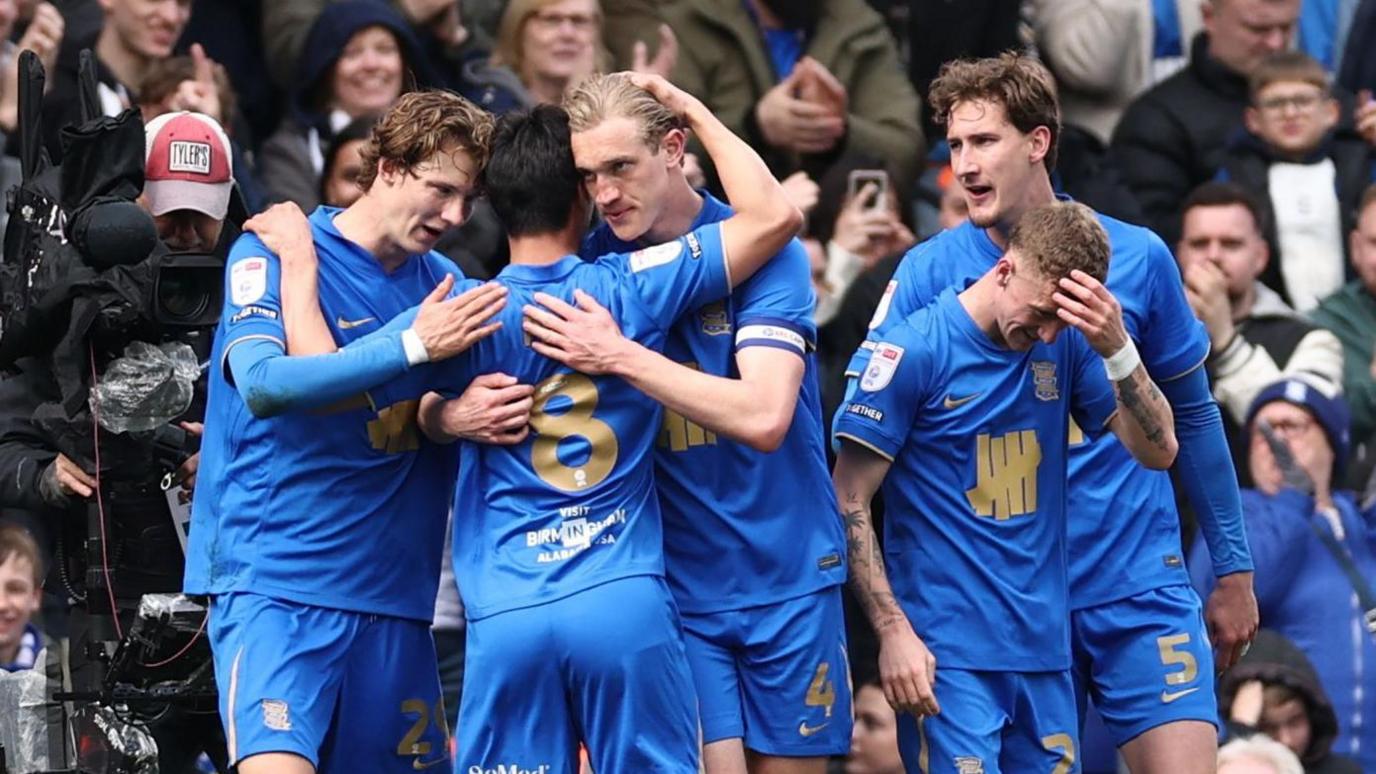 Birmingham City players celebrates Christoph Klarer's (number four, centre) goal