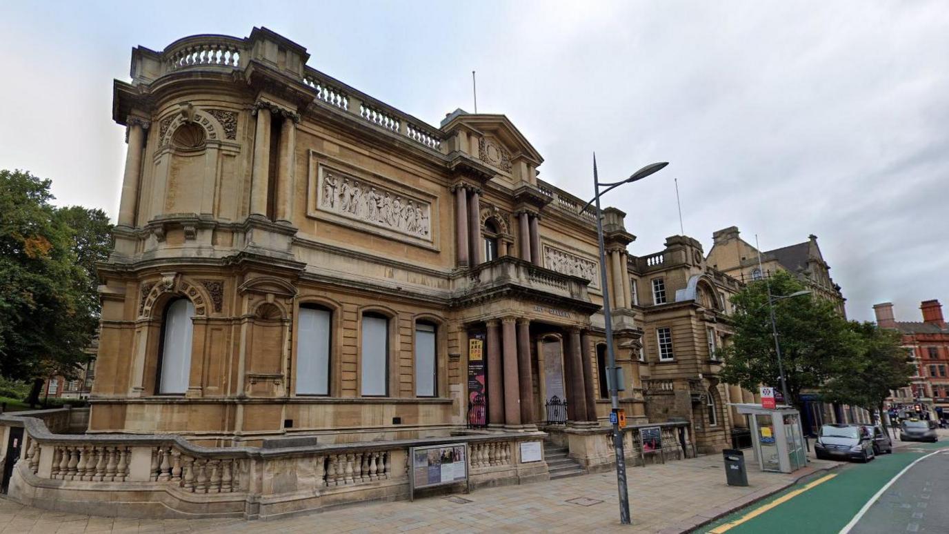 A Google street view image of Wolverhampton Art Gallery - a large old brown-coloured building. 