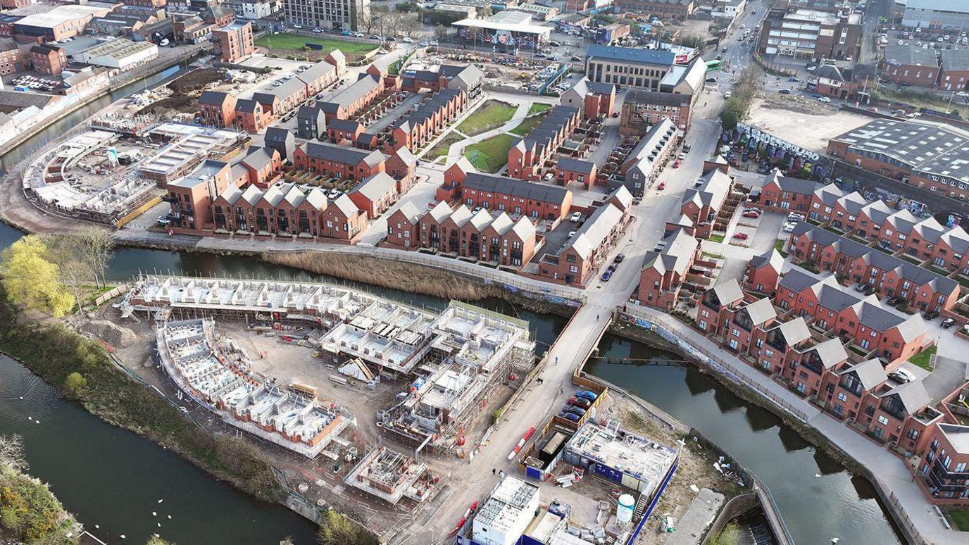 An aerial view of the latest developments at Waterside, with new homes under construction on an island