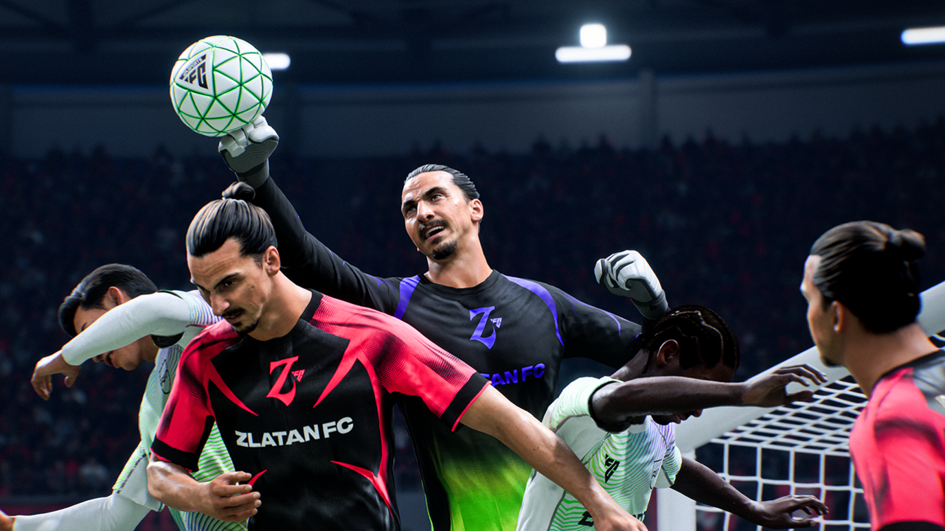 A gameplay screengrab from the new FC 26 game shows a group of footballers wearing different coloured kits all tussling for the ball in the air with a football goal net in the background.
