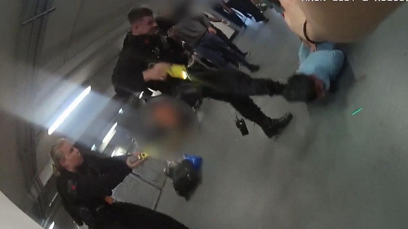 Video grab image issued by the Crown Prosecution Service (CPS)
from police body worn camera of footage of the alleged assault of three police officers at Manchester Airport which has been played to jurors at Liverpool Crown Court. 