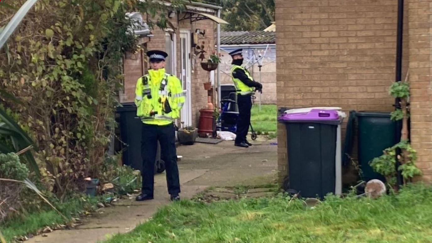 Officers outside the property