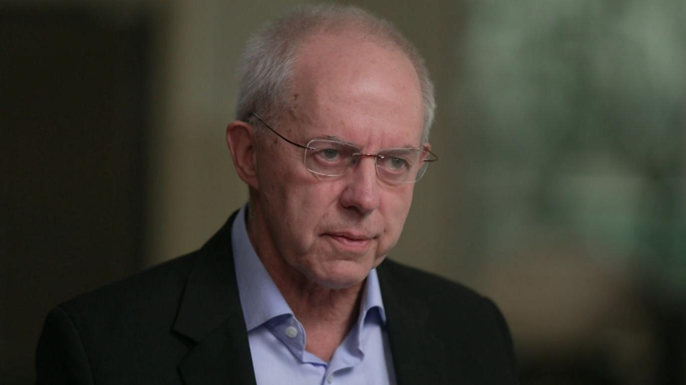 An image of Justin Welby sat down and looking ahead 