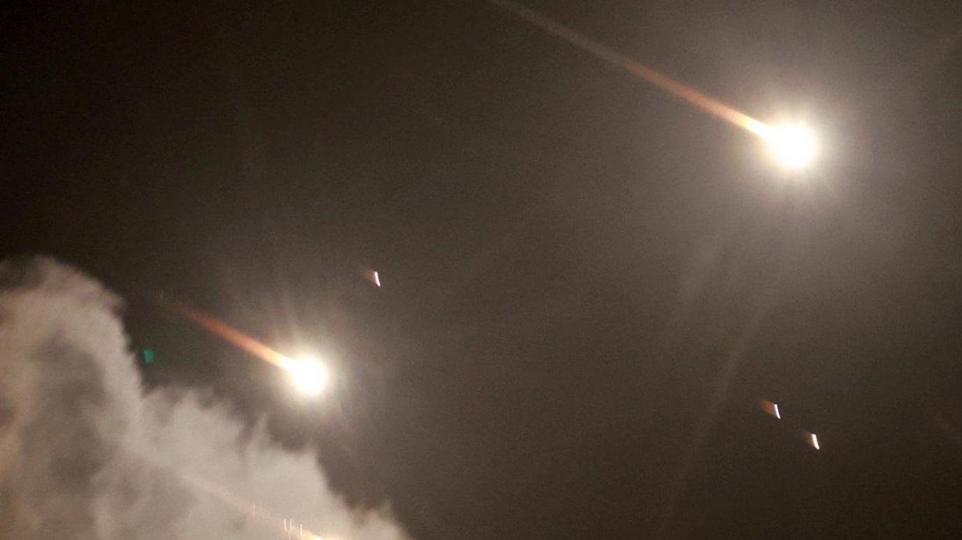 Rockets fly in the sky after Iran fired a salvo of ballistic missiles, as seen from Tel Aviv, Israel. Photo: 1 October 2024