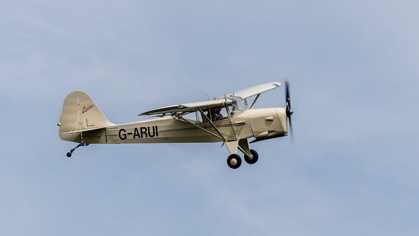 An ex-Army Auster, which John Cooper took a flight in