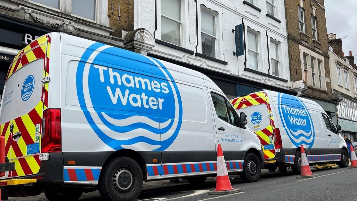 Thames Water vans parked by the side of the road