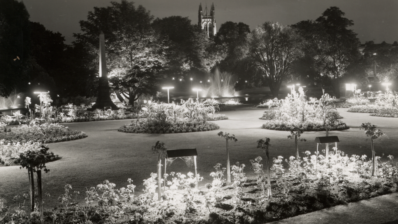 A black and white photo of sections of Jephson Gardens lit up