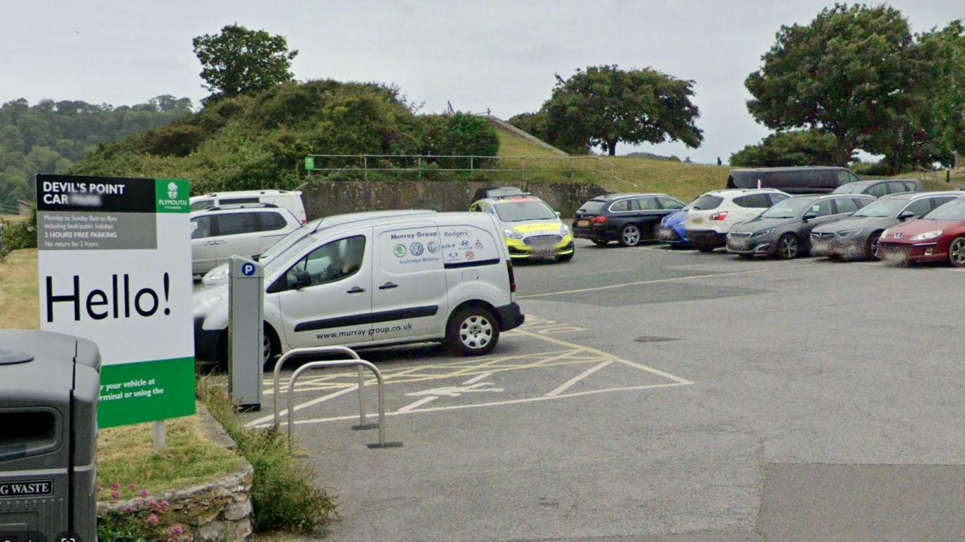 A view of the car park. It is an open air ground level car park.