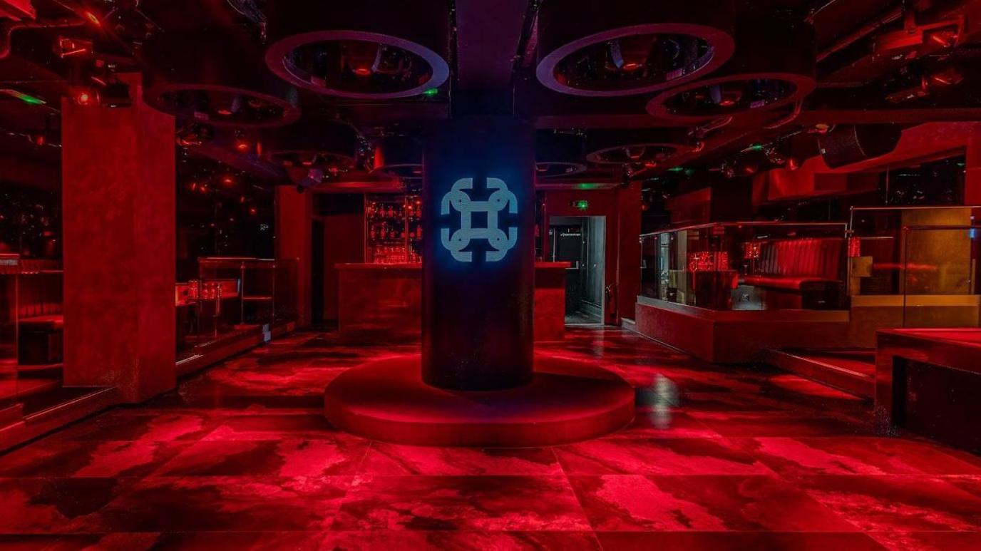 Inside the Concept Club nightclub, featuring ruby red carpeted floor and pillars