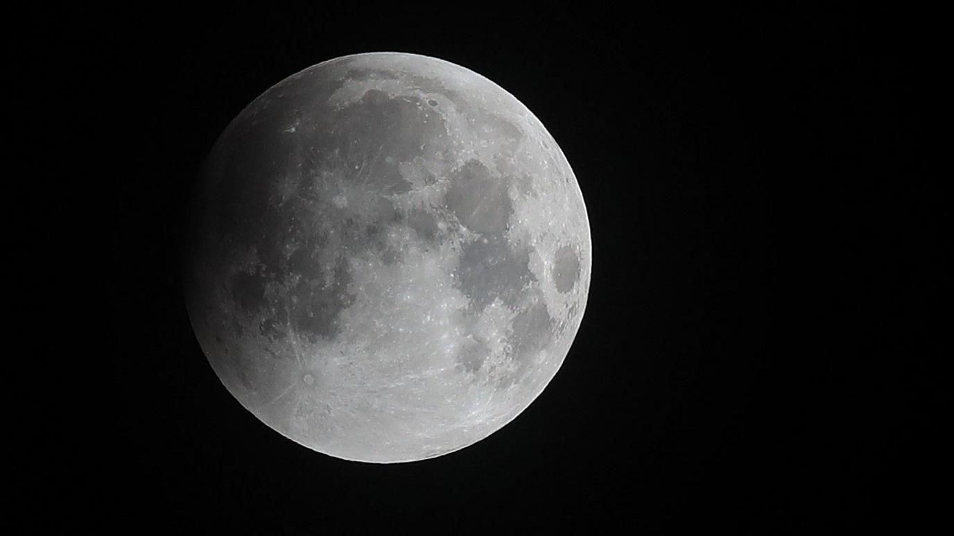 A grey view of the super blood wolf moon during a lunar eclipse