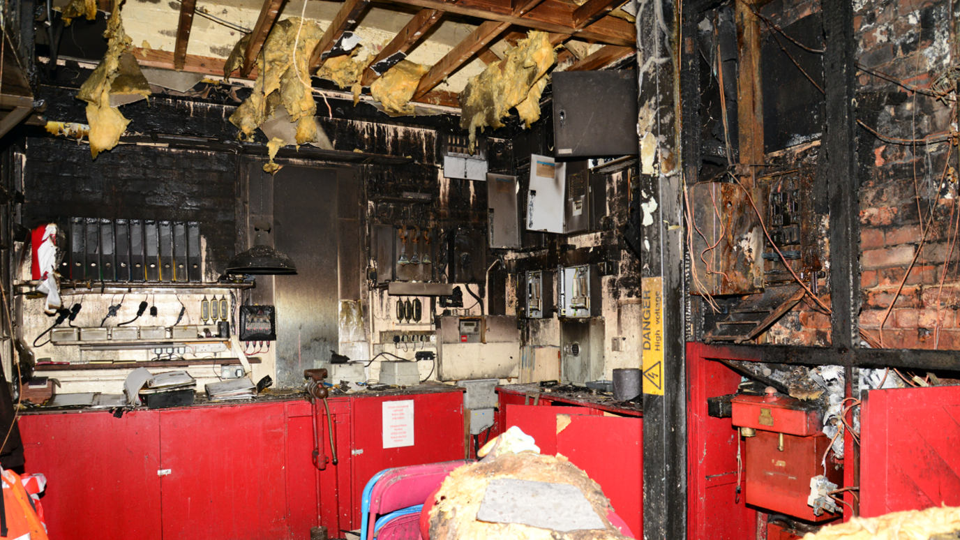 Burned wires and insulation inside the building