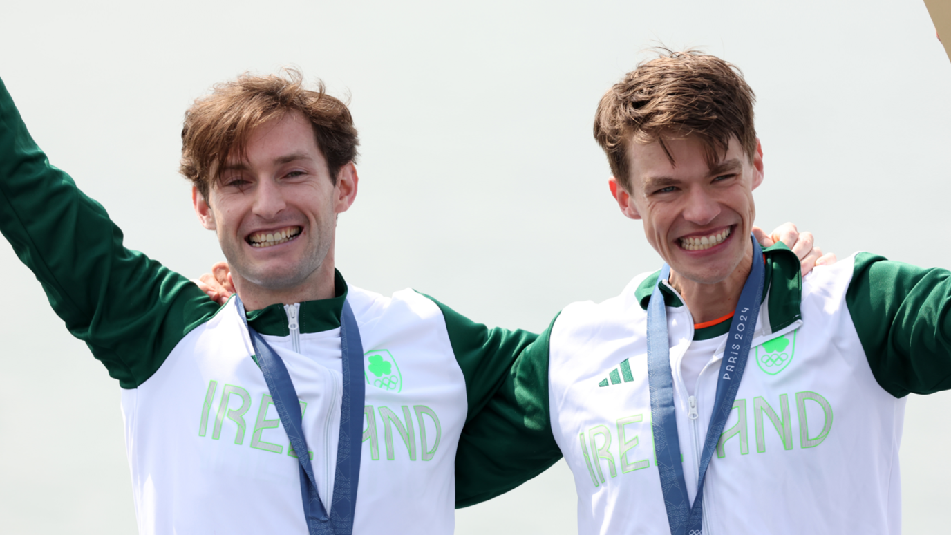 Paul O’Donovan and Fintan McCarthy standing with their arms round each other 