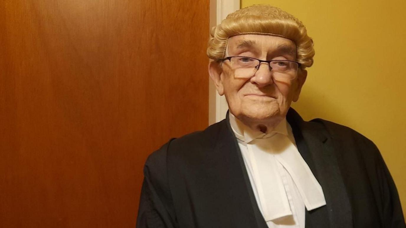 Noel Philo dressed is his barrister attire, including wig and gown.