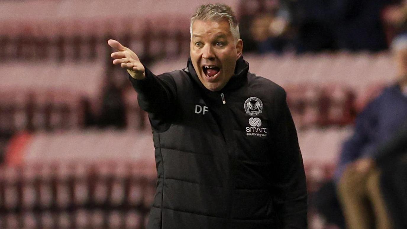 Darren Ferguson shouts instructions from the touchline during a Peterborough United match