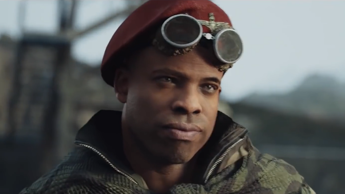 Lt Arthur Kingsley stands gazing to one side in a scene from the video game Call of Duty: Vanguard. He wears a soldier's uniform and a red beret.