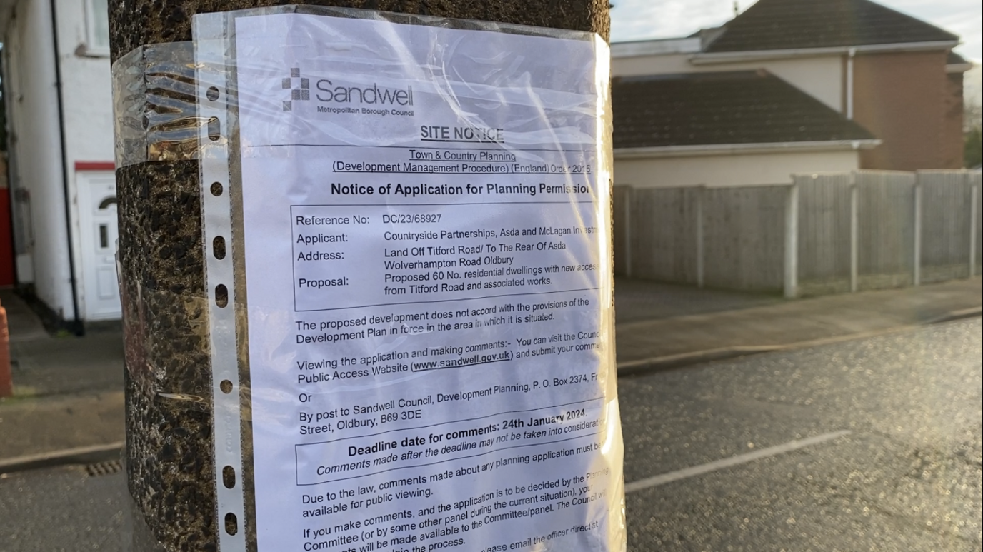 A planning notice taped onto a lamppost. It has Sandwell Council branding and says SITE NOTICE at the top in the capital letters. 