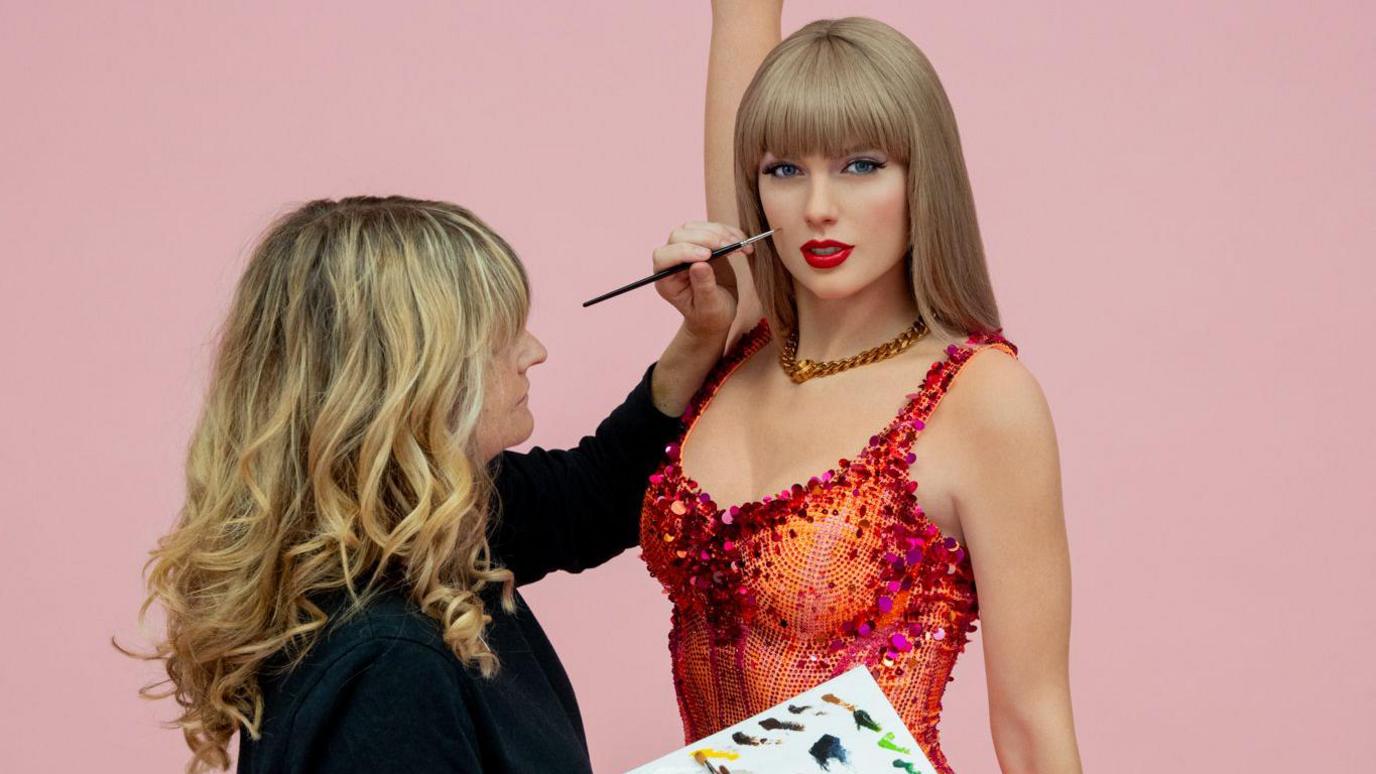 Finishing touches being made to a Taylor Swift wax figure.