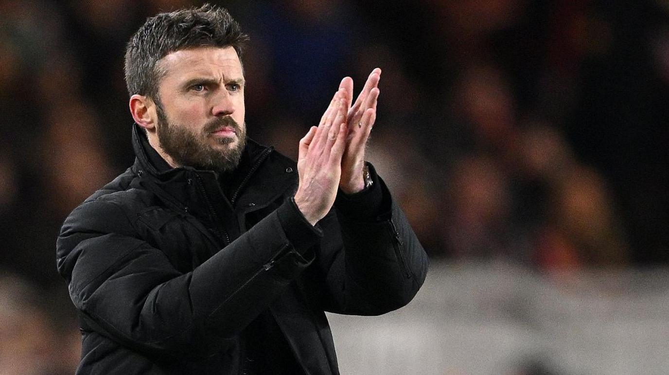 Michael Carrick applauds