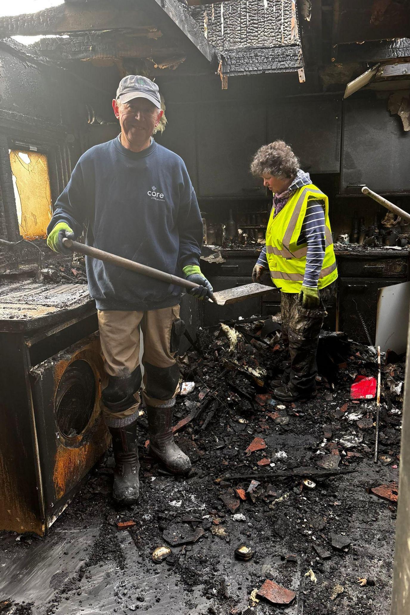 What is left of the kitchen is rubble and black soot.