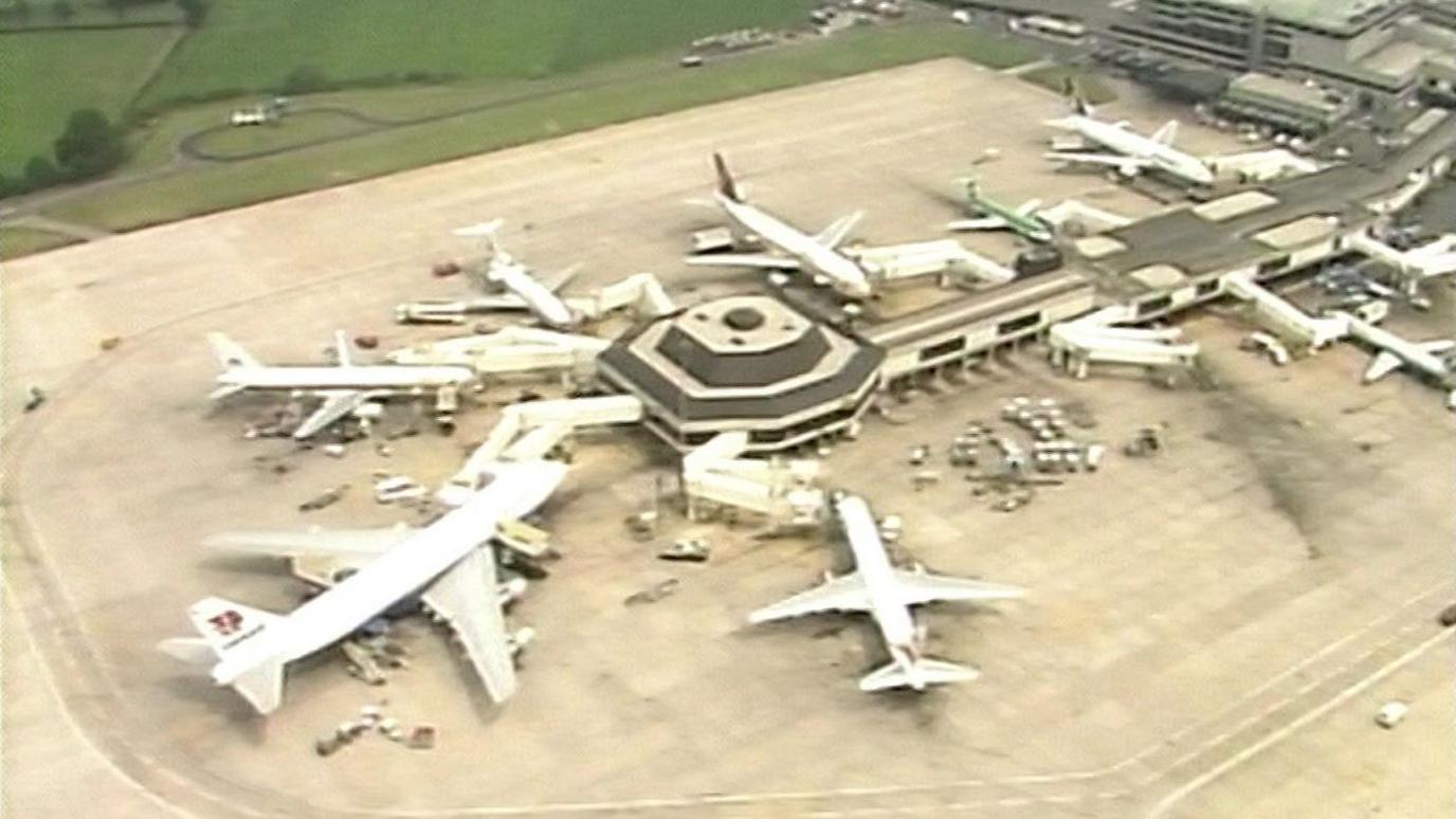 Old footage of planes parked around the terminal