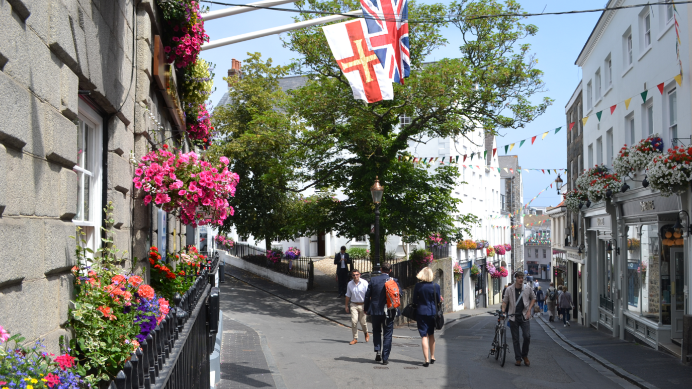 People walking along Guernsey road