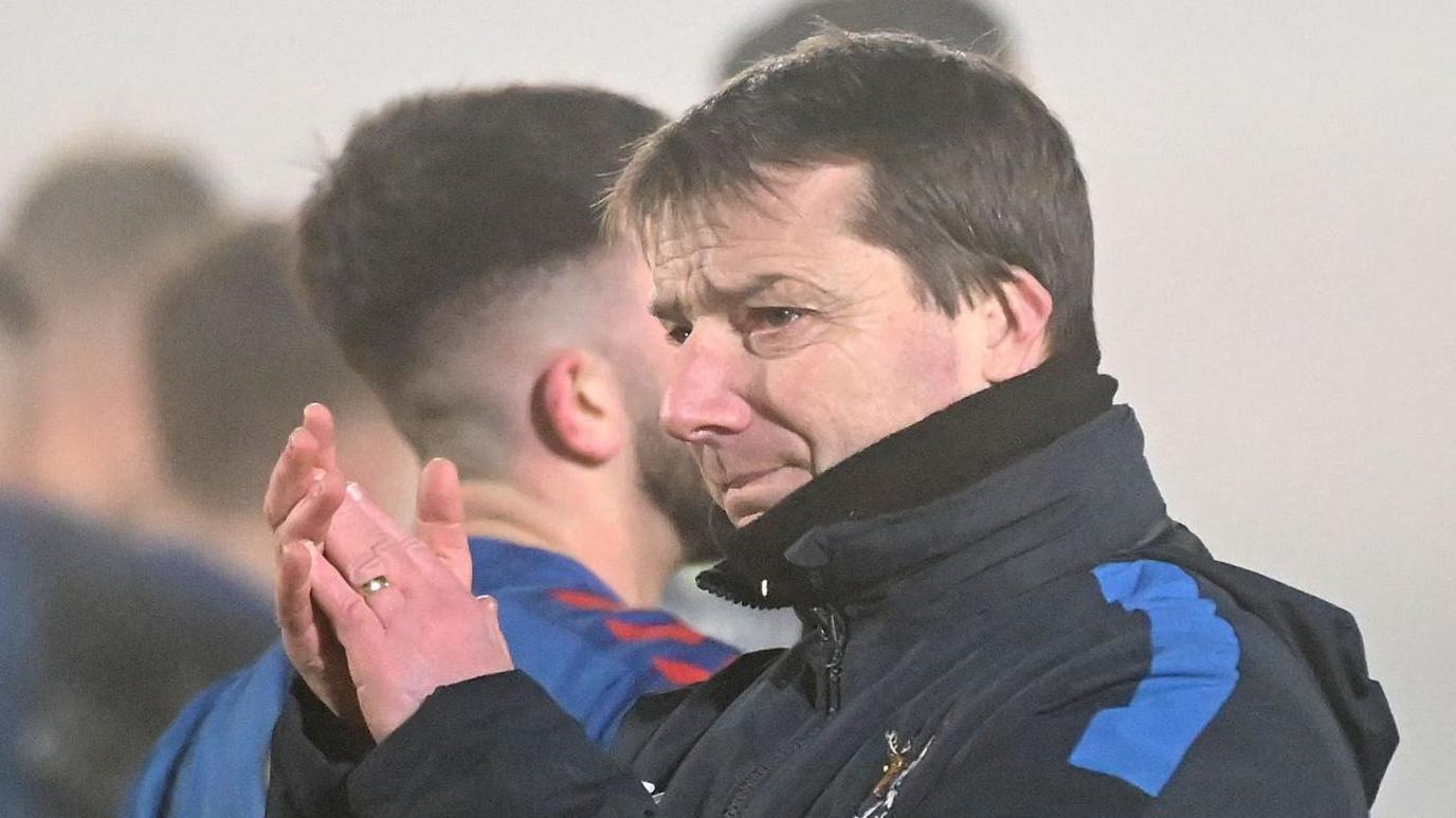 John Bailie applauds the Ards fans after the big upset at the Showgrounds