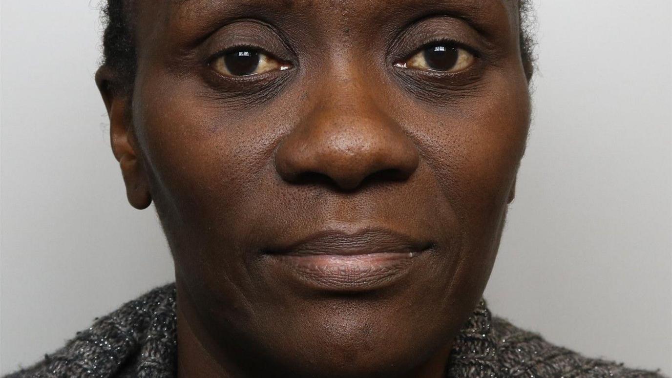 A police mugshot of Lydia Mugambe