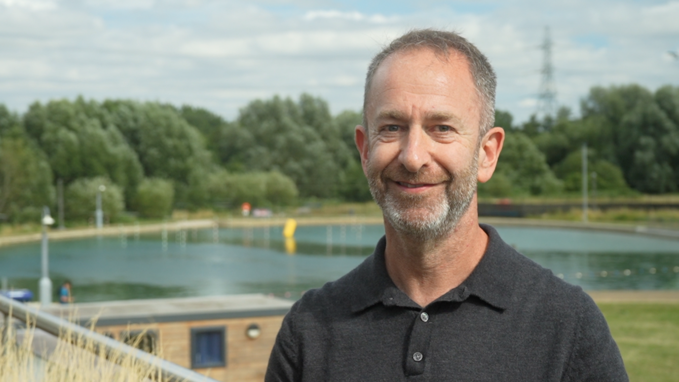 A portrait photo of Steve Bromberg with a lake in the background