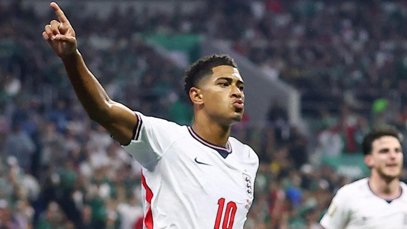 Jude Bellingham turns away in celebration after putting England ahead in their World Cup last 16 meeting with Mexico in The Azteca.