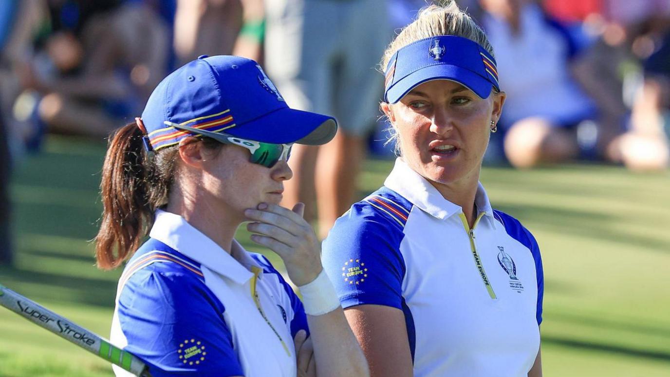 Europe's Leona Maguire and Charley Hull chatting during their fourball match against the US in 2023