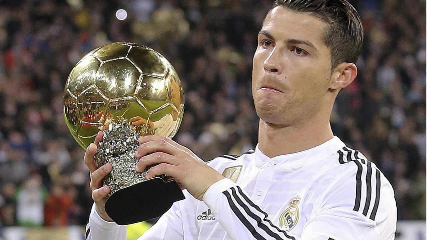 Cristiano Ronaldo shows off the Ballon d'Or trophy