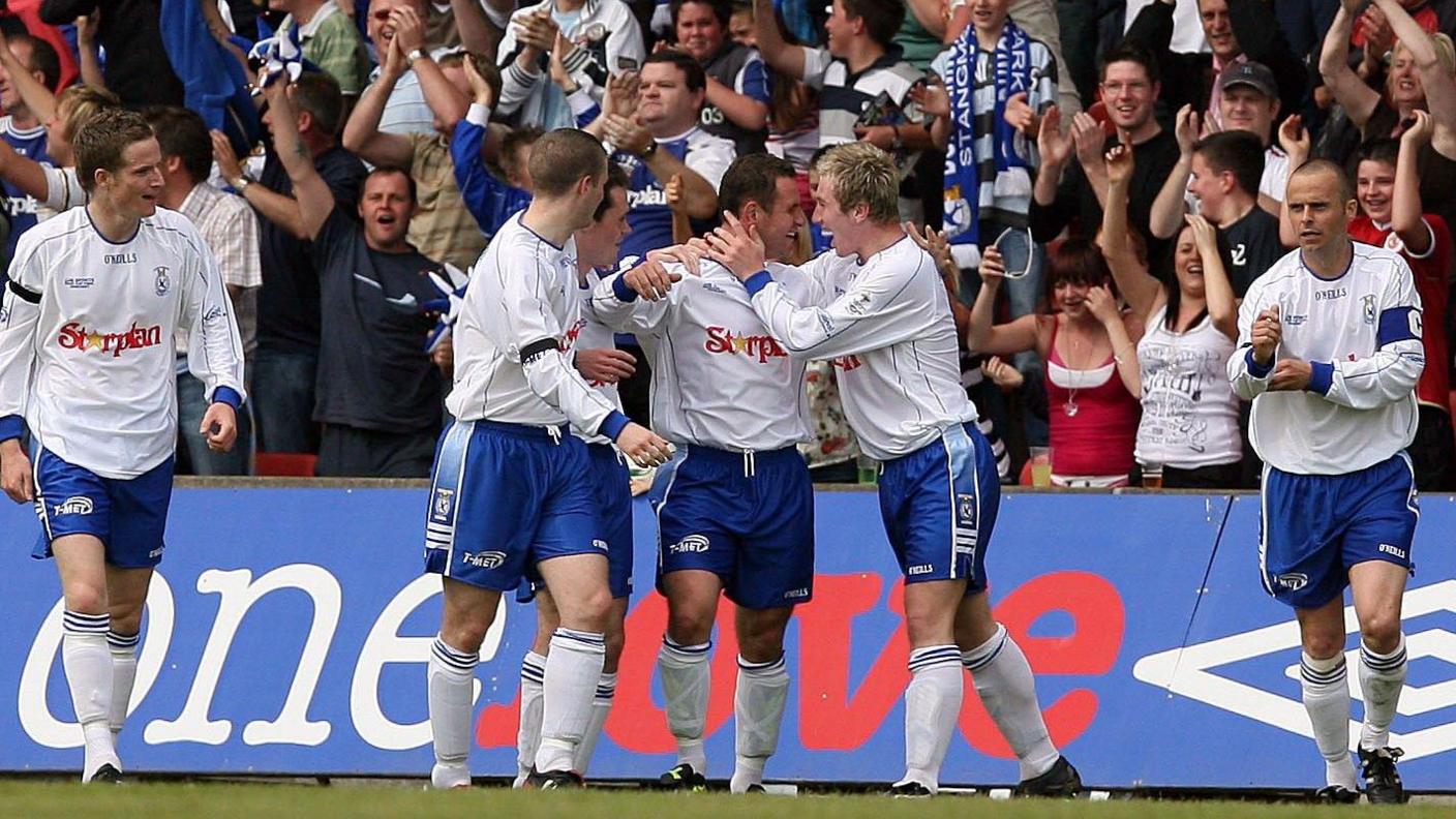 Dungannon players celebrate an equaliser
