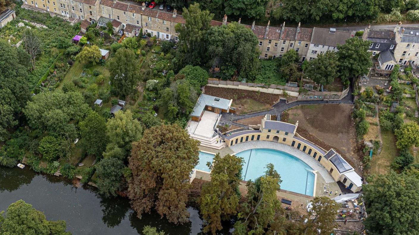 Aerial view of lido and nearby homes and river