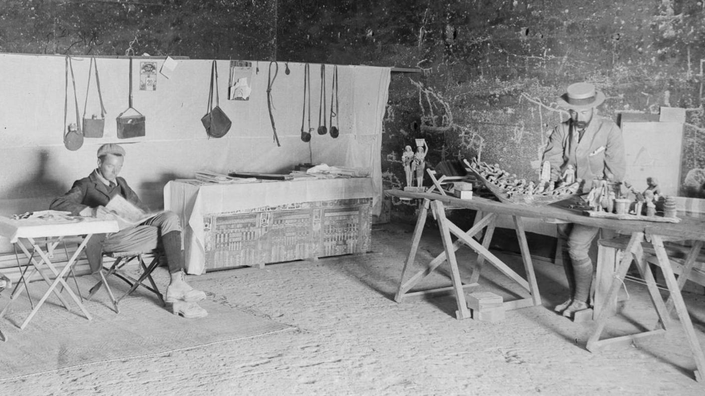 Professor John Garstang (right) and a colleague with Egyptian artefacts 