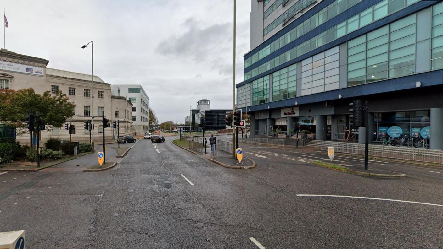 Streetview image of St George's Way, Leicester, showing an urban dual carriageway and traffic lights