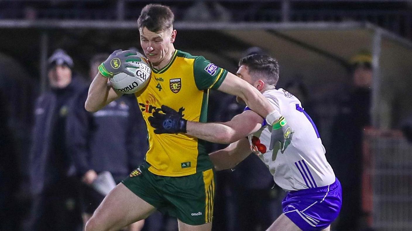 Mark Curran and David Garland battle for possession in Healy Park