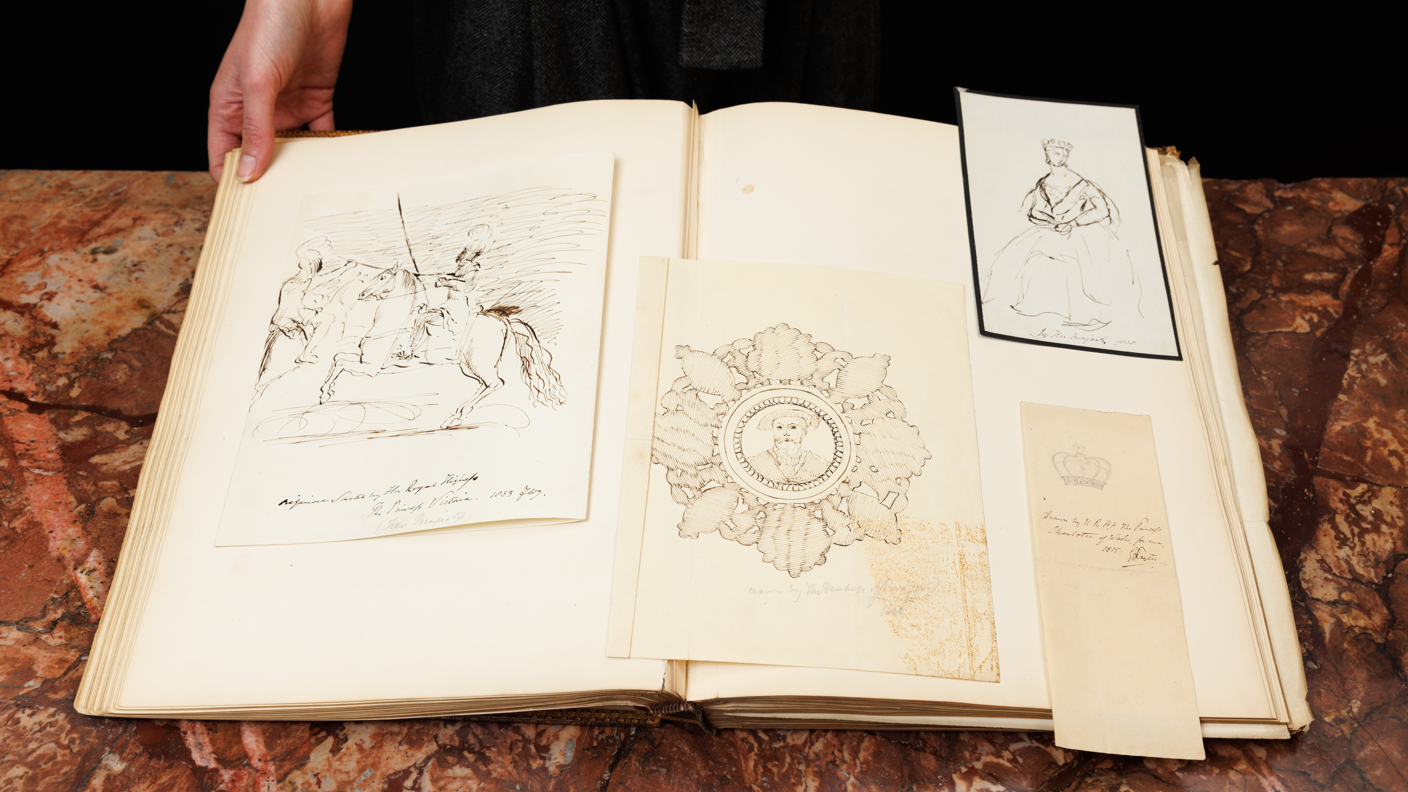 A book containing several images drawn by Queen Victoria.