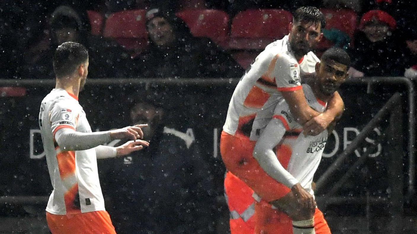 Blackpool celebrate their equaliser against Leyton Orient 