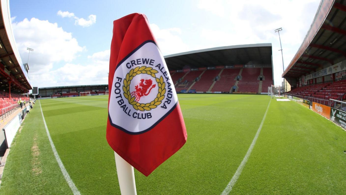 Crewe corner flag with stadium in background