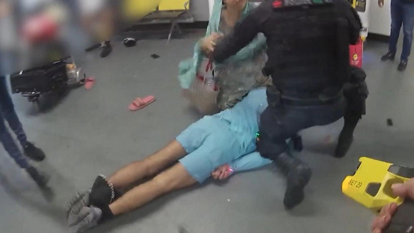Video grab image issued by the Crown Prosecution Service (CPS)
from police body worn camera of footage of the alleged assault of three police officers at Manchester Airport which has been played to jurors at Liverpool Crown Court