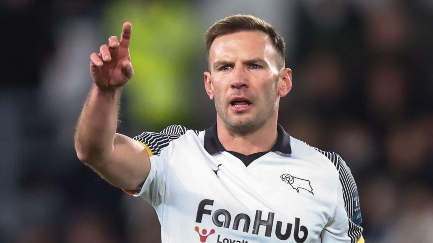 Derby's Andi Weimann raises his arm to signal for the ball