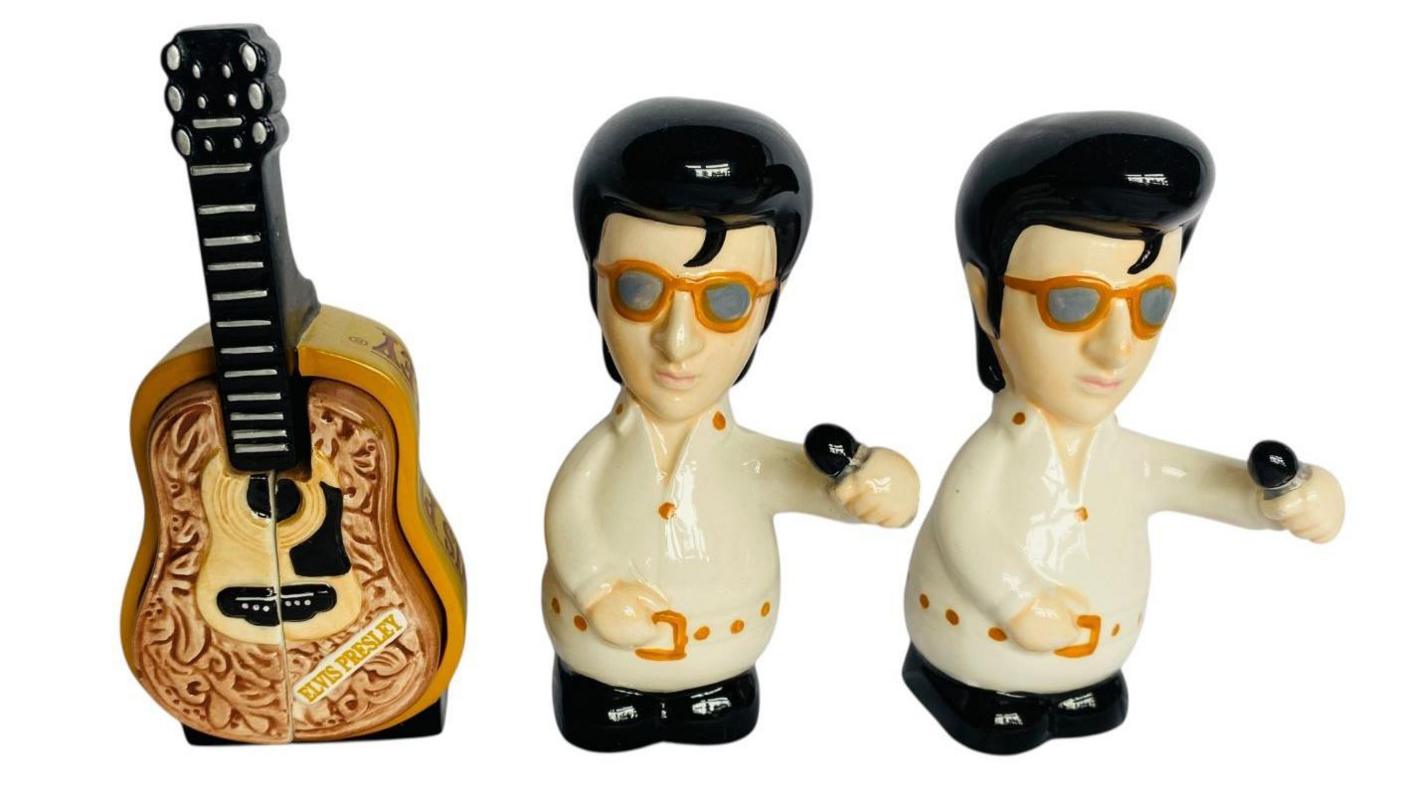 Elvis-themed salt and pepper pots along with a guitar which has Elvis Presley's name on it.