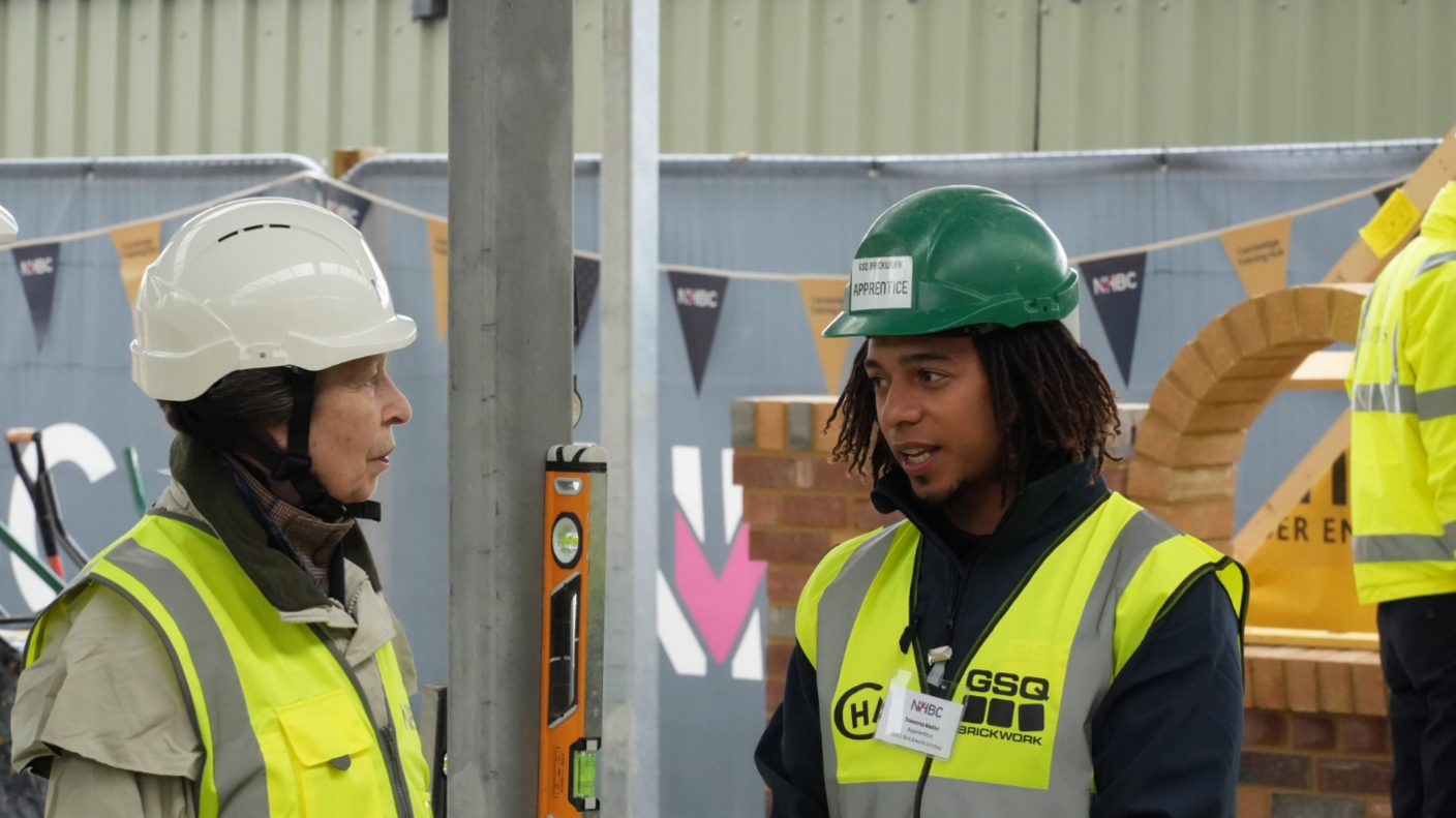 Princess Anne with Tawona Mativi, bothing wearing high-vis jackets and helmets