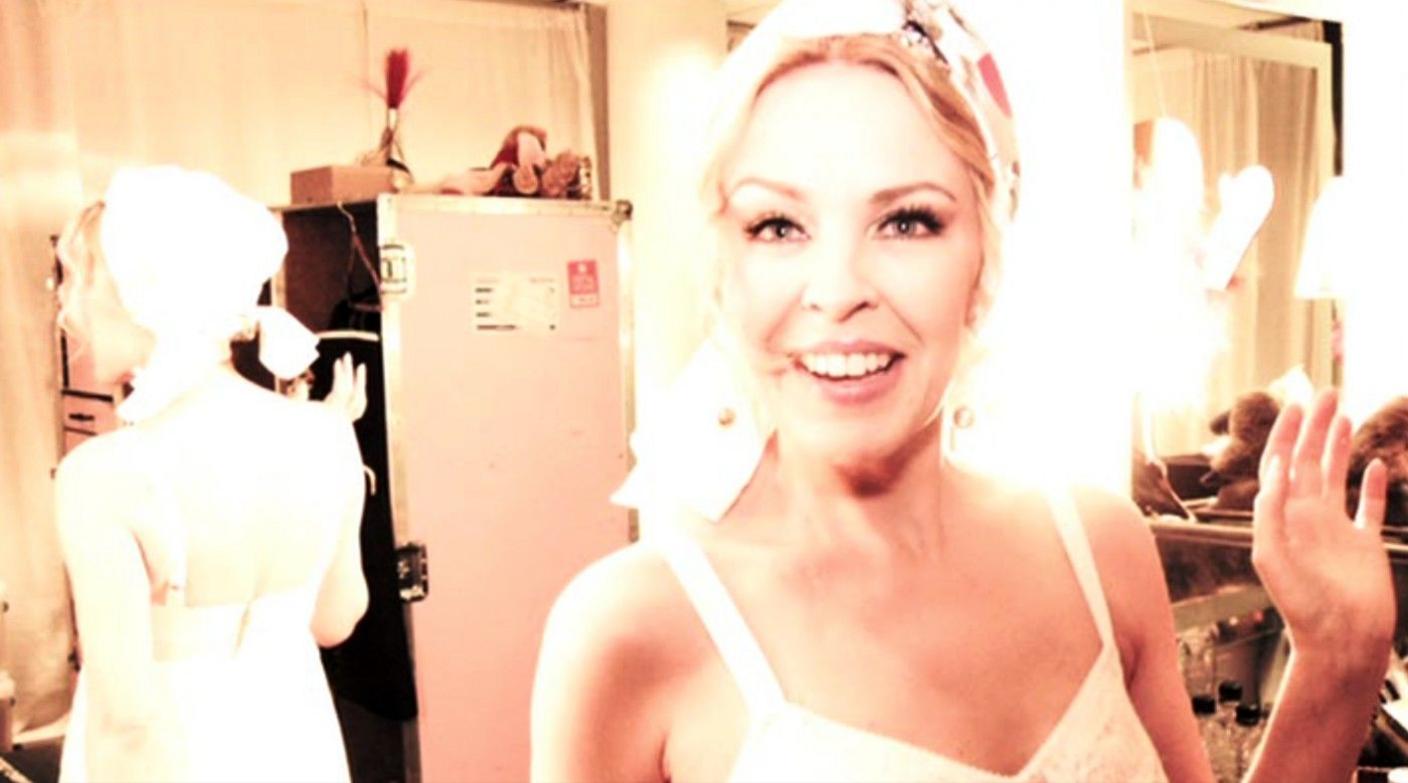 Backstage on the 2011 Aphrodite: Les Folies Tour, Kylie fashioned her own merchandise into a makeshift turban