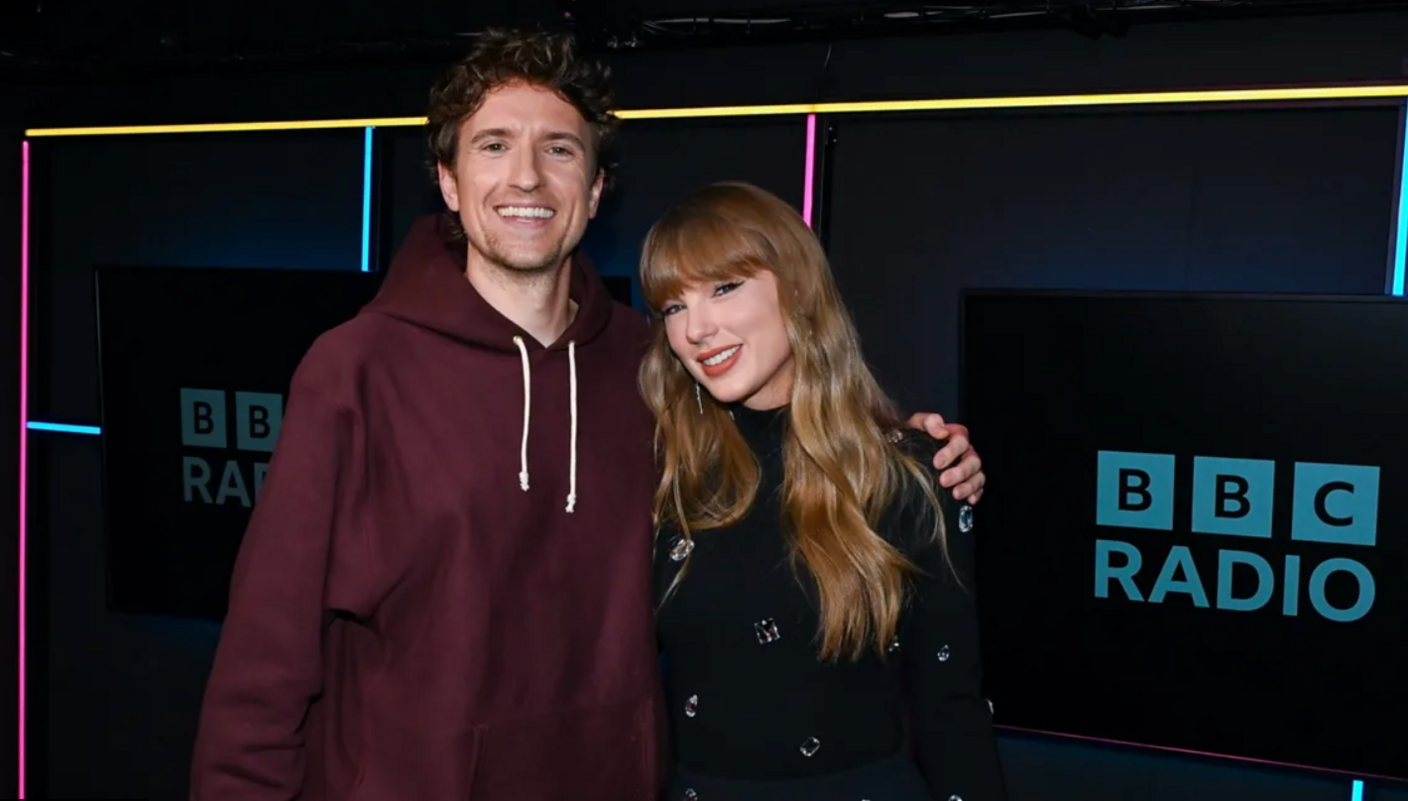 Taylor Swift posing with Gregg James 