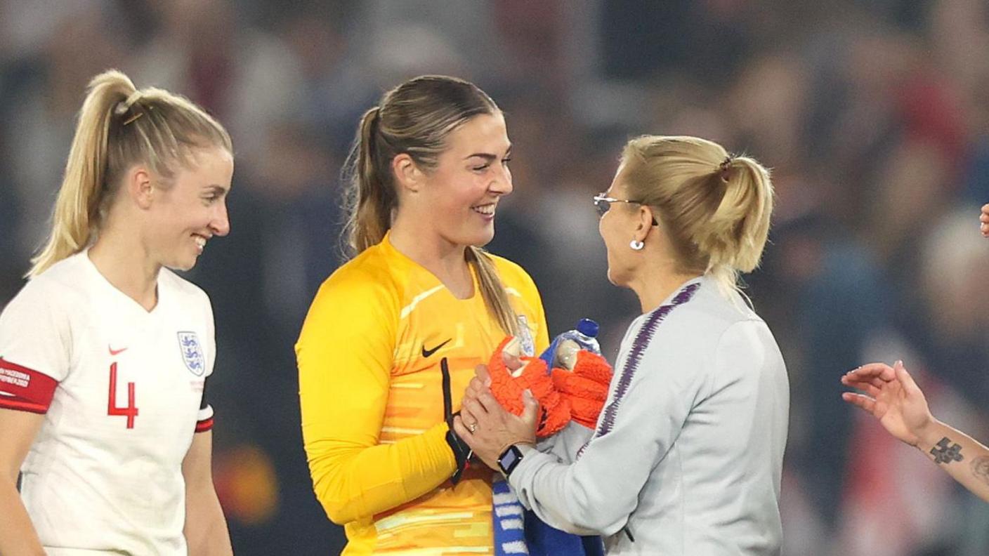 Sarina Wiegman congratulates Mary Earps after her first match in charge