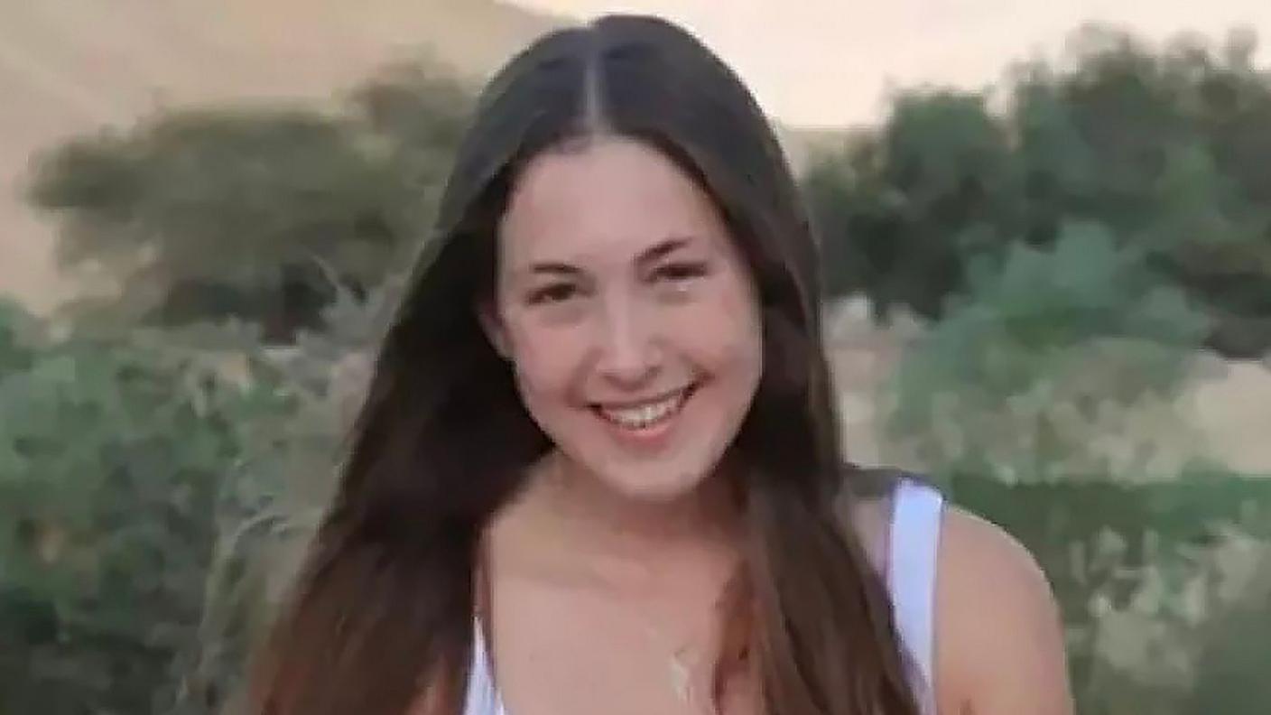 Naama Levy smiling. She has long, dark, straight brown hair and brown eyes